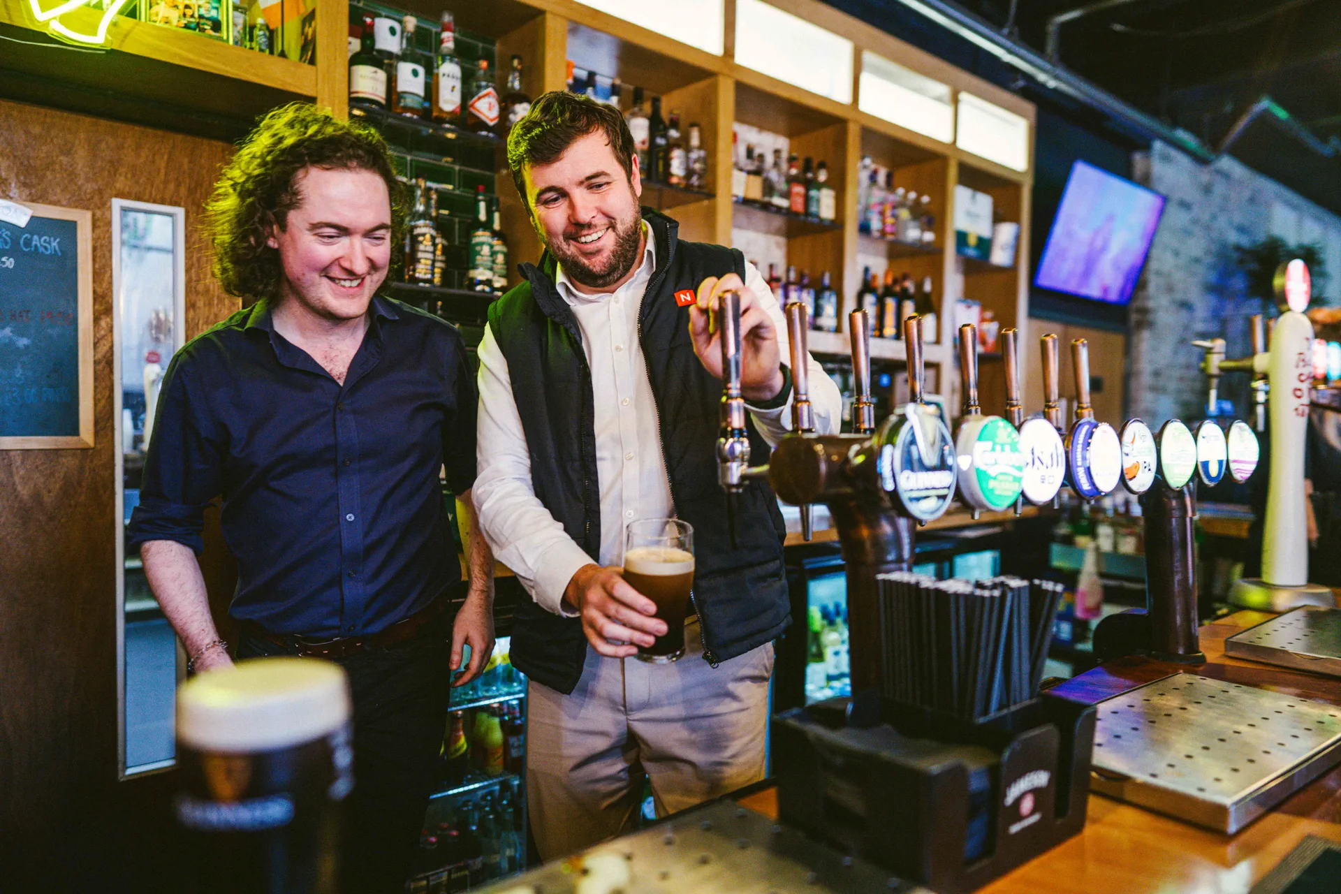 Bartenders pouring fresh pints of Guinness at Nortons Digbeth