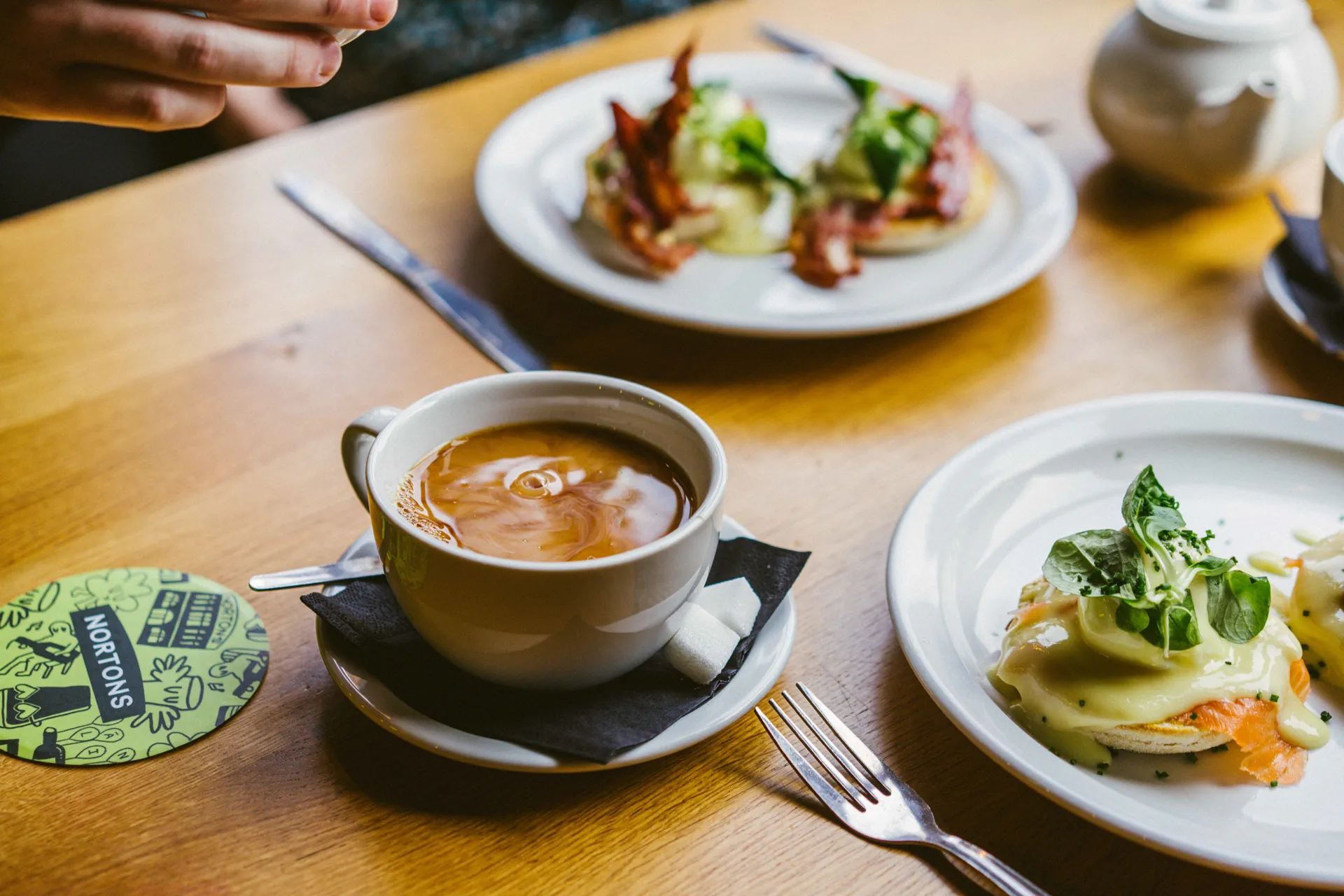 Eggs Benedict with rich golden hollandaise sauce on artisanal bread