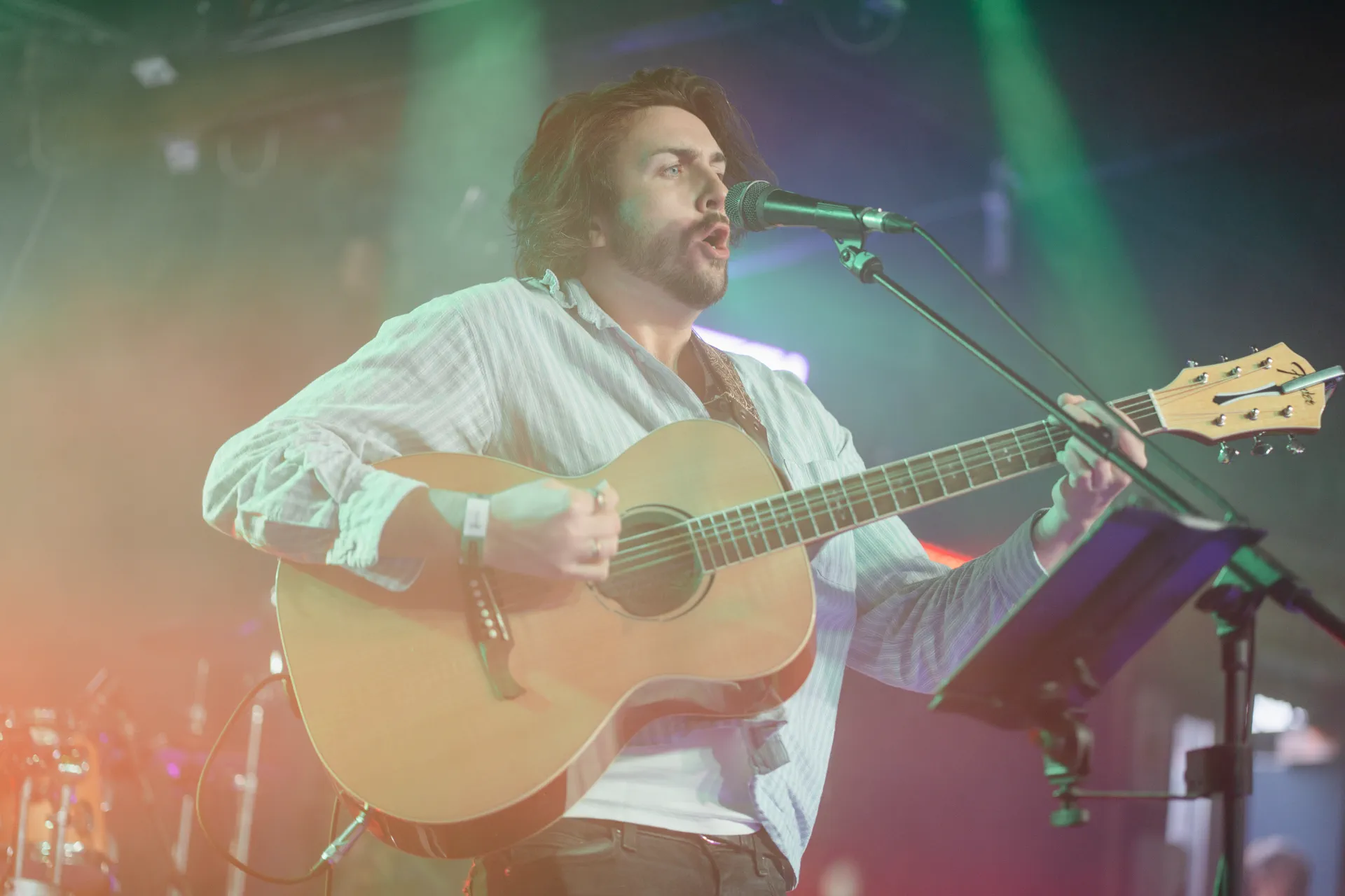 Live acoustic Irish musicians playing trad music on stage