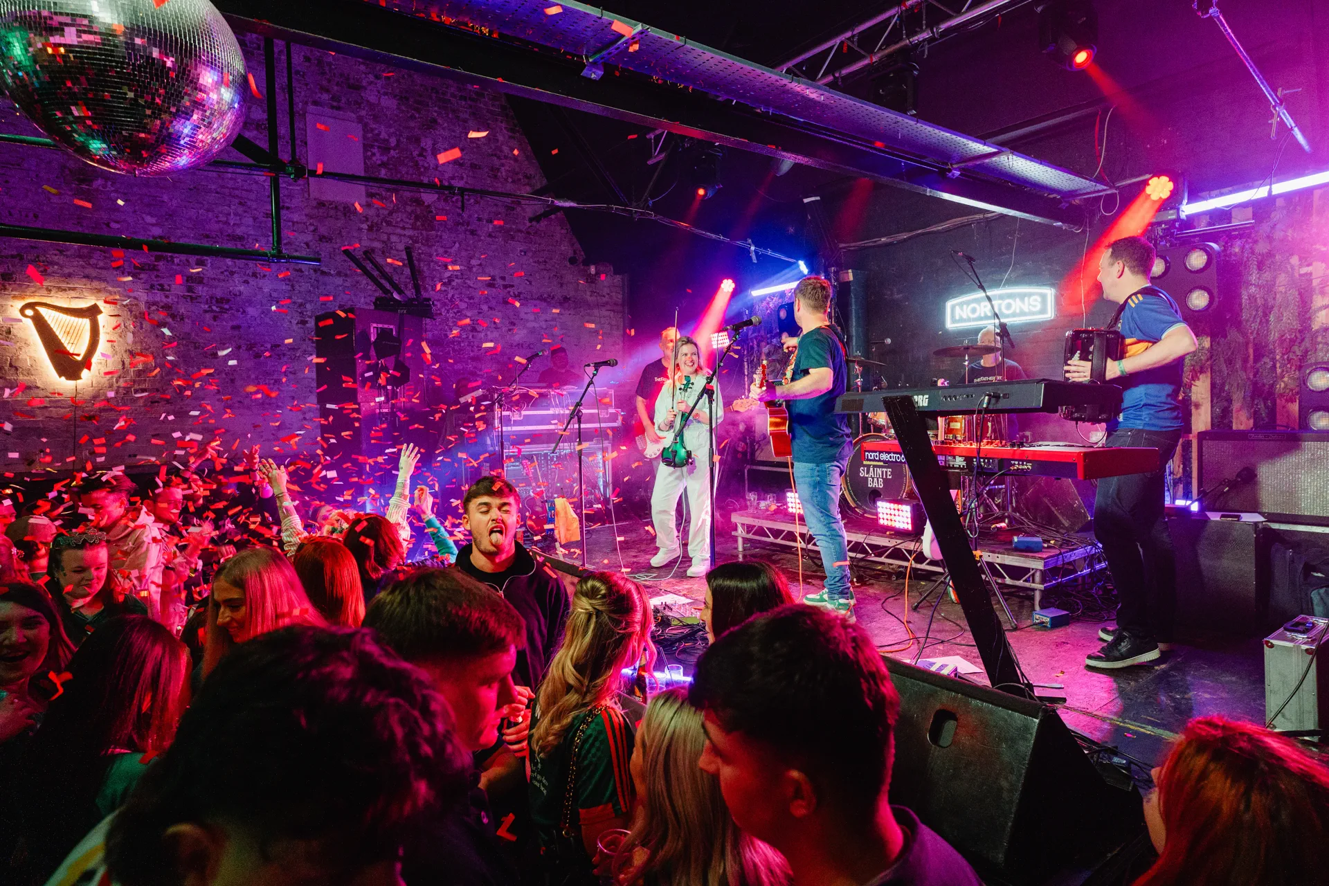 The Back Bar concert room at Nortons Digbeth with live band, disco ball and confetti shower