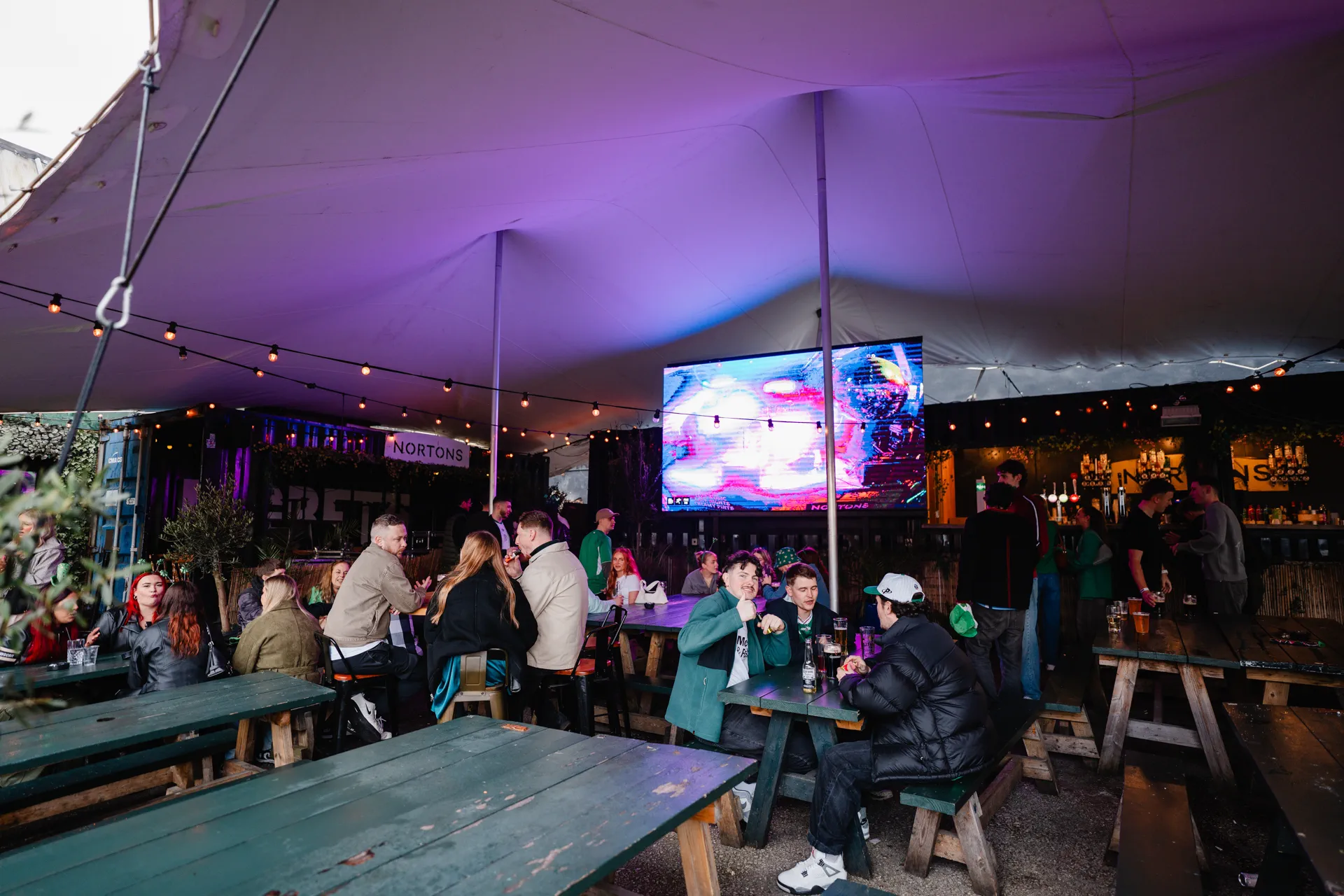 The Garden covered and heated marquee at Nortons Digbeth with festoon lights and giant screen