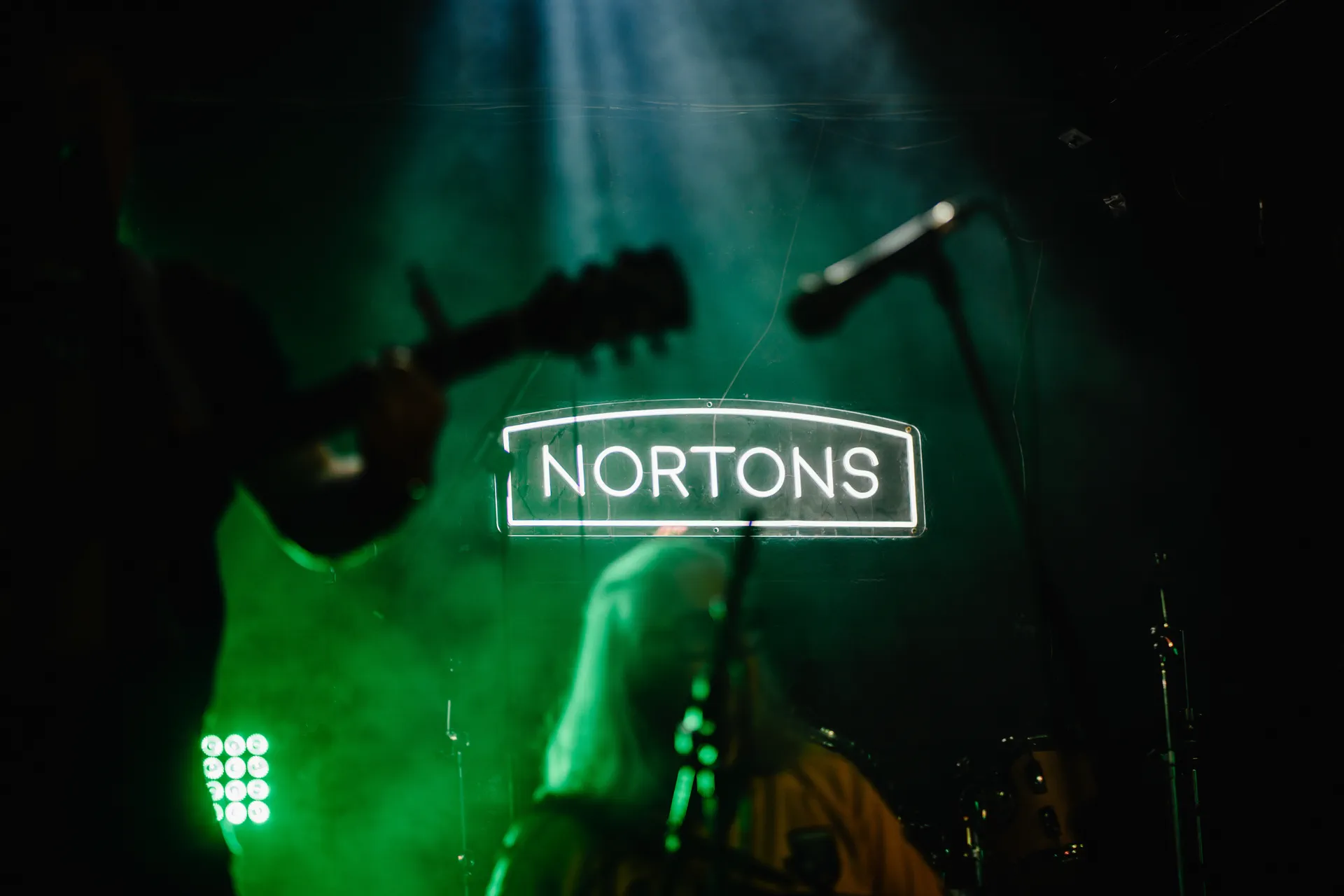 Nortons Digbeth main stage and glowing neon sign for Entire Venue Christmas takeover