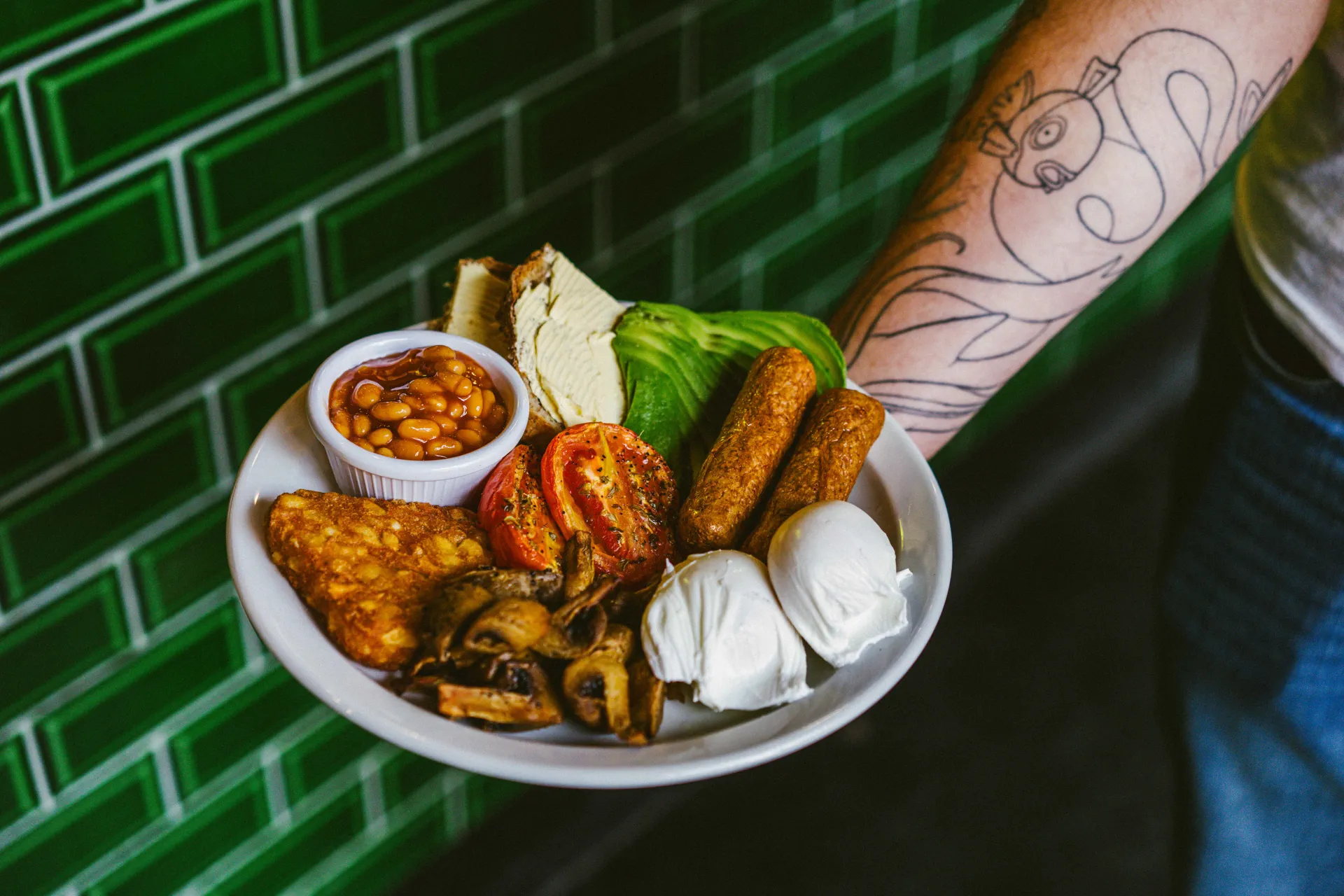Vegetarian cooked breakfast skillet with vine roasted tomatoes mushrooms hash browns
